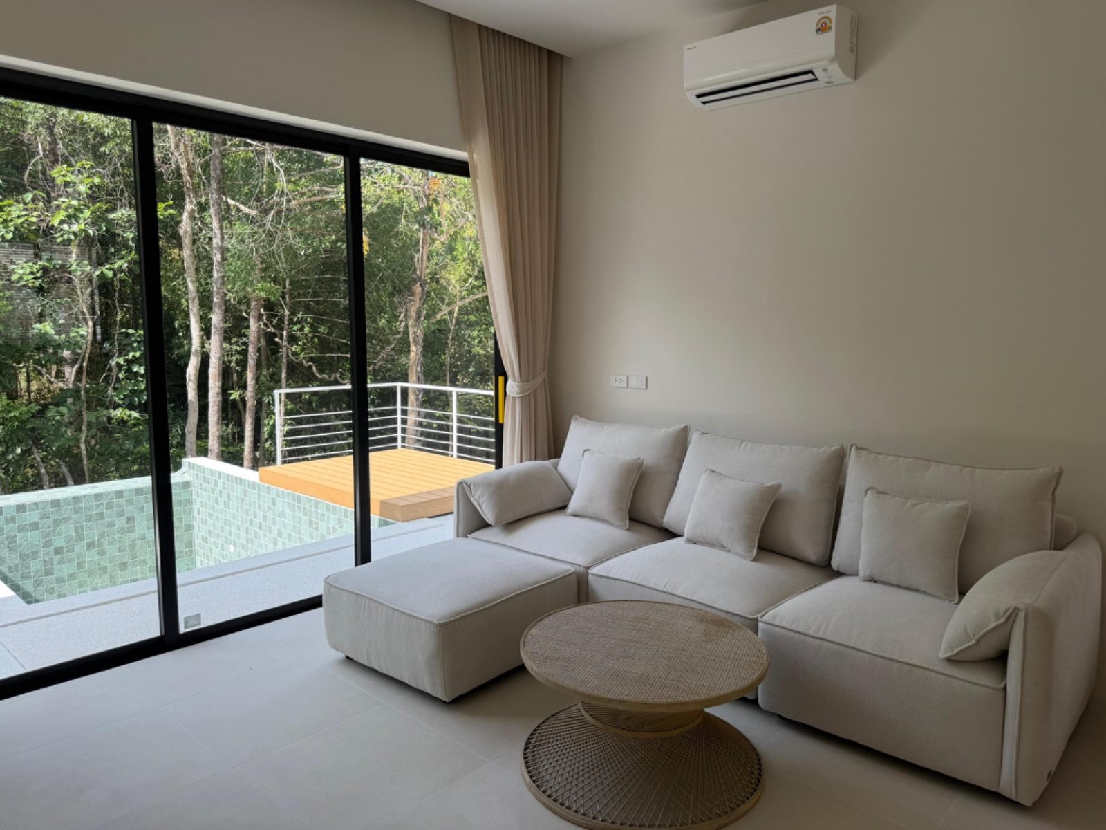 Living room with pool view before and after AI enhancement compared to professional photography - before